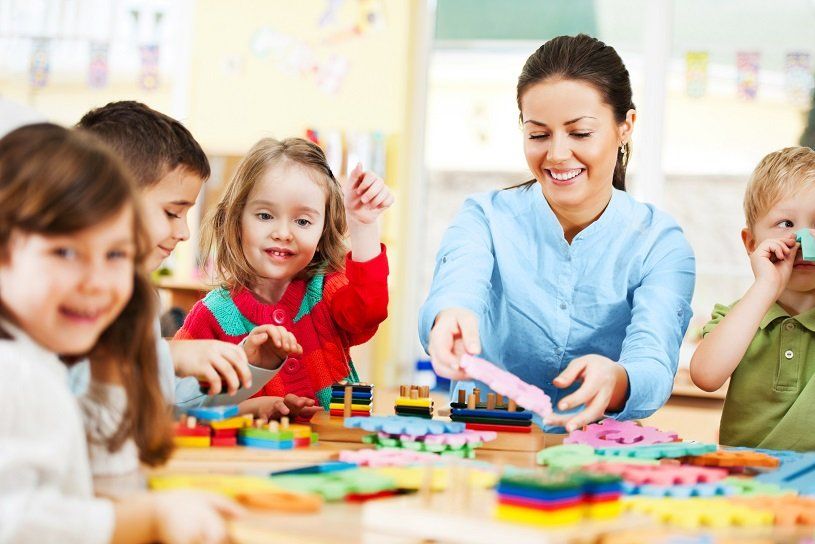 Kids and teacher in childcare