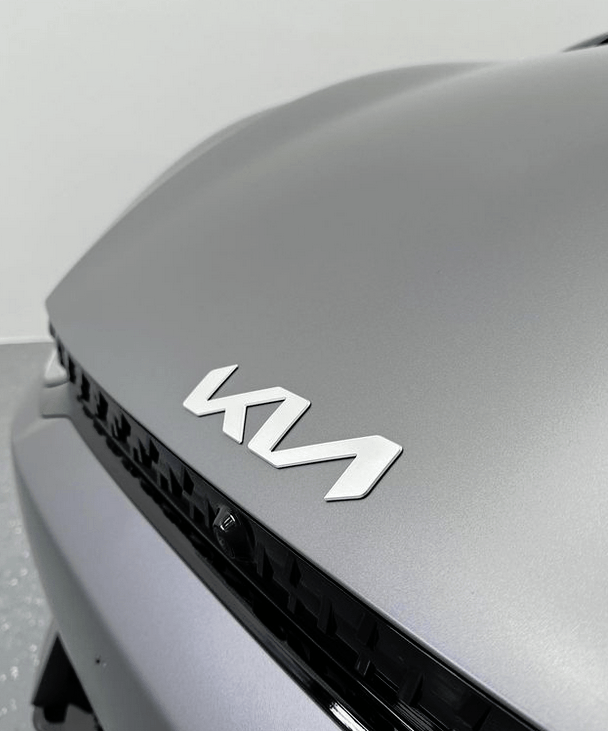 A gray KIA EV6 GT car in for ceramic coating in Rouse Hill with front bonnet getting coated.