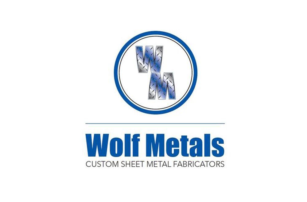 a logo for wolf metals custom sheet metal fabricators