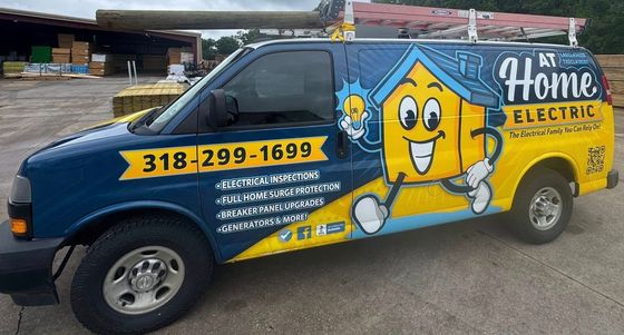 A home electric van is parked in a parking lot.