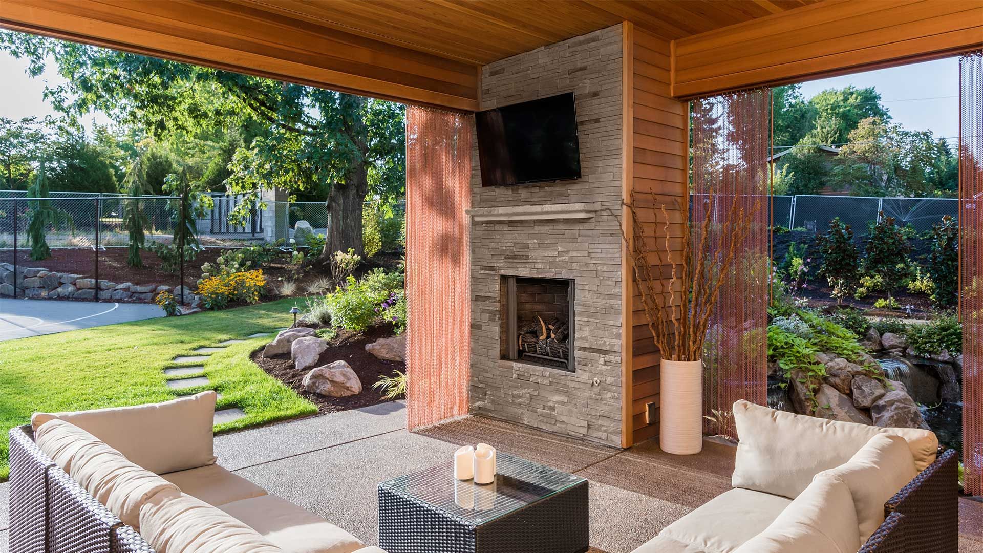 A living room with a fireplace and a flat screen tv.