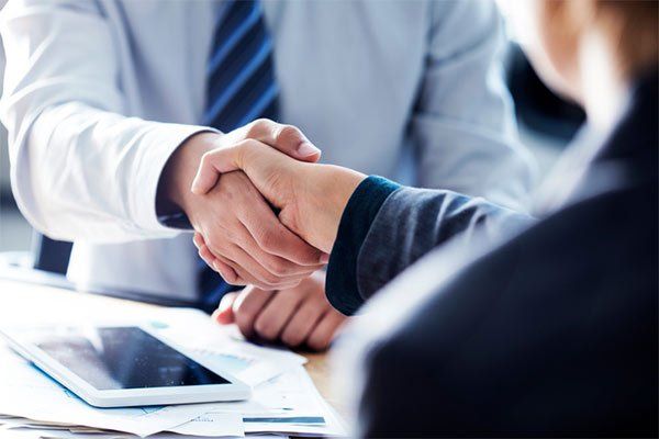 Insurance Providers — Businessman Handshake in the Office in Largo, MD