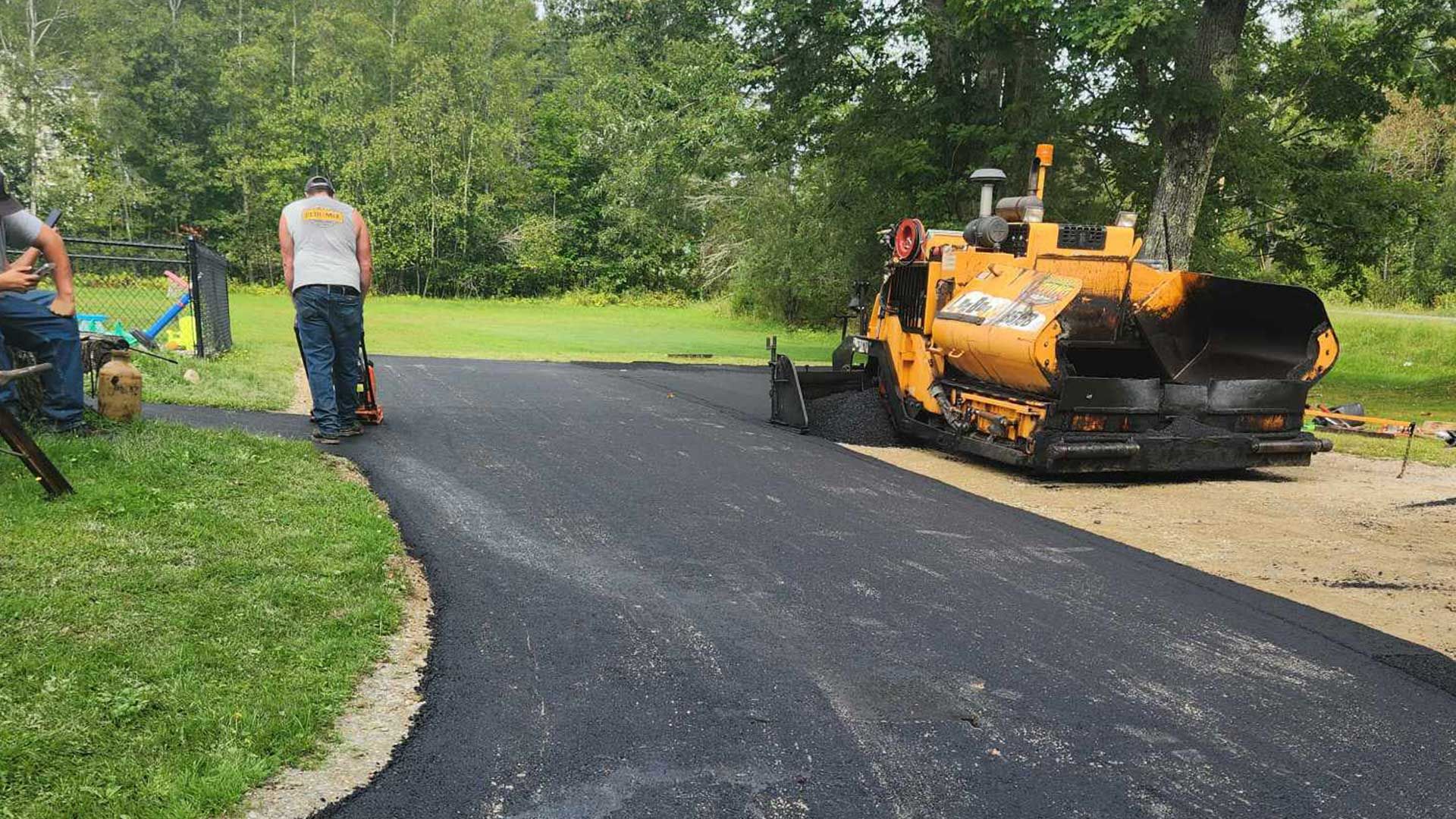 applying an asphalt overlay to a long driveway, Coldbrook Paving, Bangor