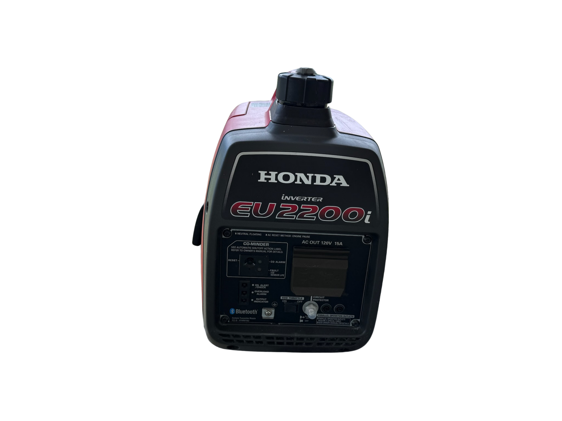 A honda generator is sitting on a white surface.