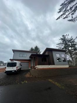 Modern house and parked van in driveway