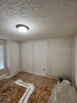 Room construction with popcorn ceiling