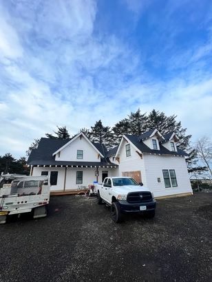 White farmhouse under construction