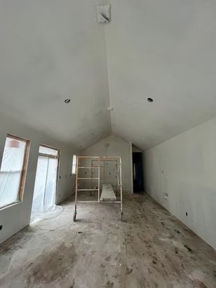 Empty room under construction with concrete floor