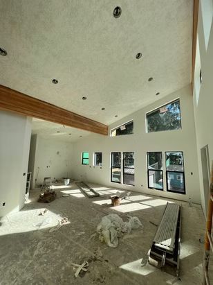 Interior of a room under construction with white walls