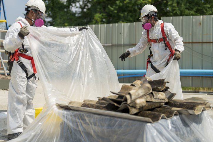 Men Covering Roof With Asbestos – Canberra, NSW – Ozbestos