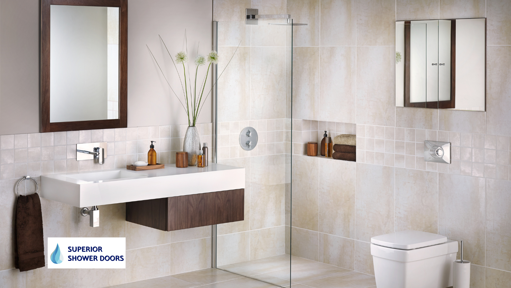 A bathroom with a sink a toilet and a walk in shower