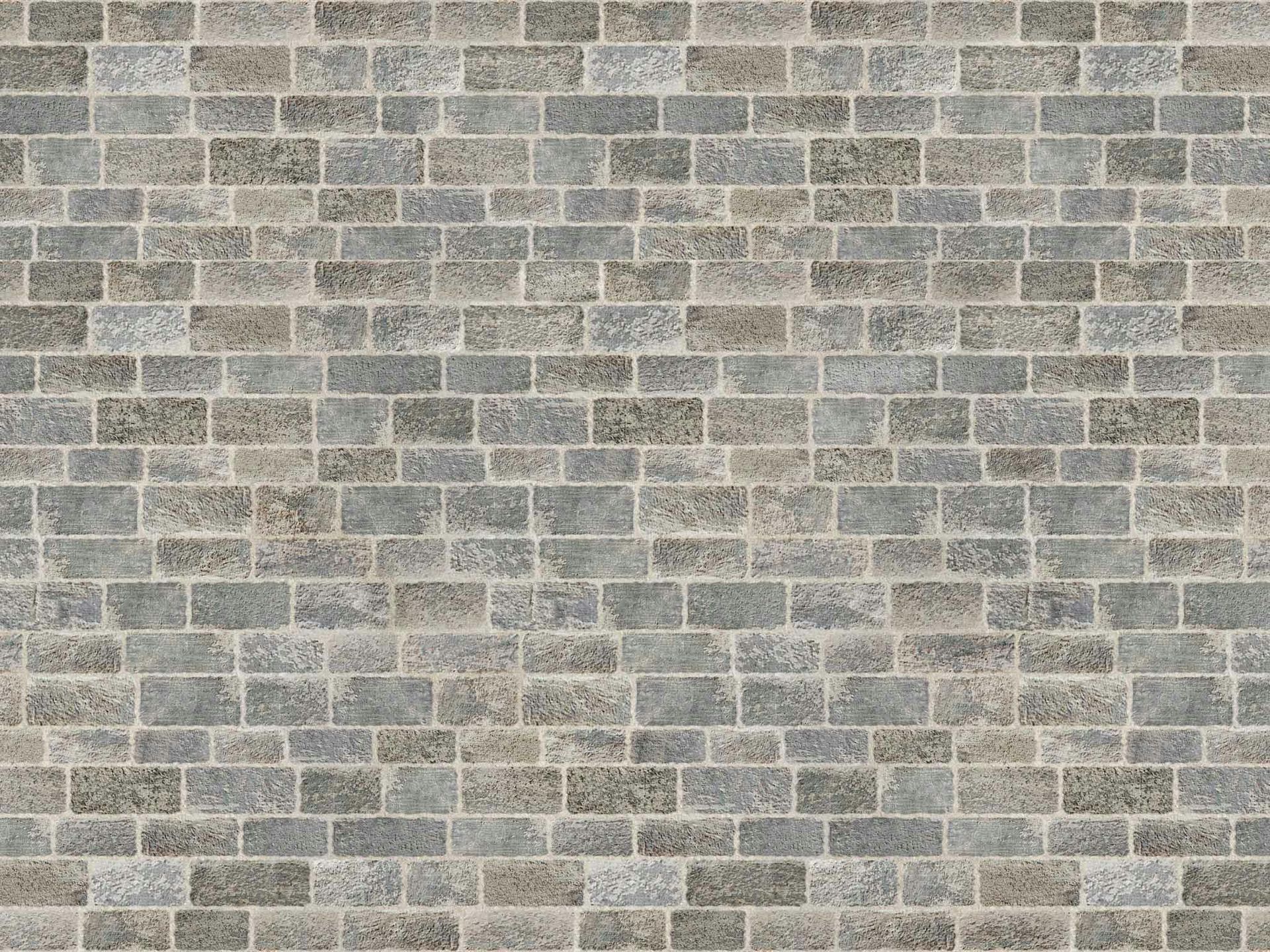 Gray brick wall with alternating brick rows.