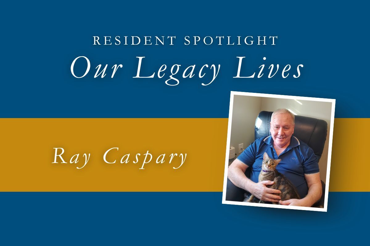 Resident Spotlight: Ray Caspary, holding a cat, on a background of blue and gold.