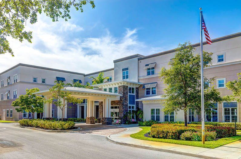 A large building with a flag in front of it.