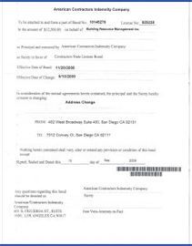 a white piece of paper with a blue border is sitting on a table .