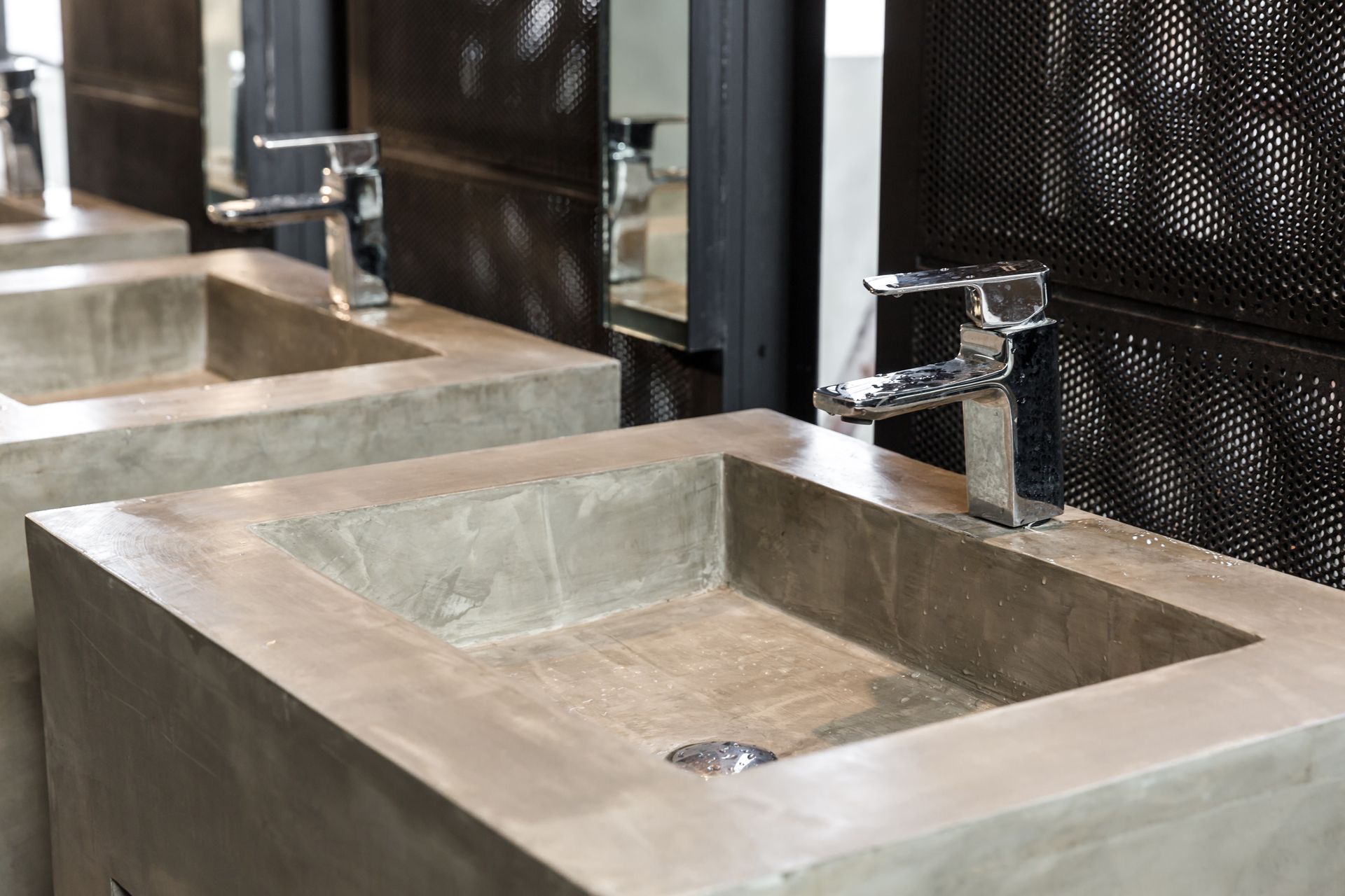 a bathroom with two sinks and a mirror .