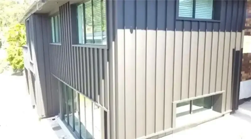 An Aerial View Of A House With A Metal Siding And A Lot Of Windows — Sattin's Metal Roofing In Avondale, NSW