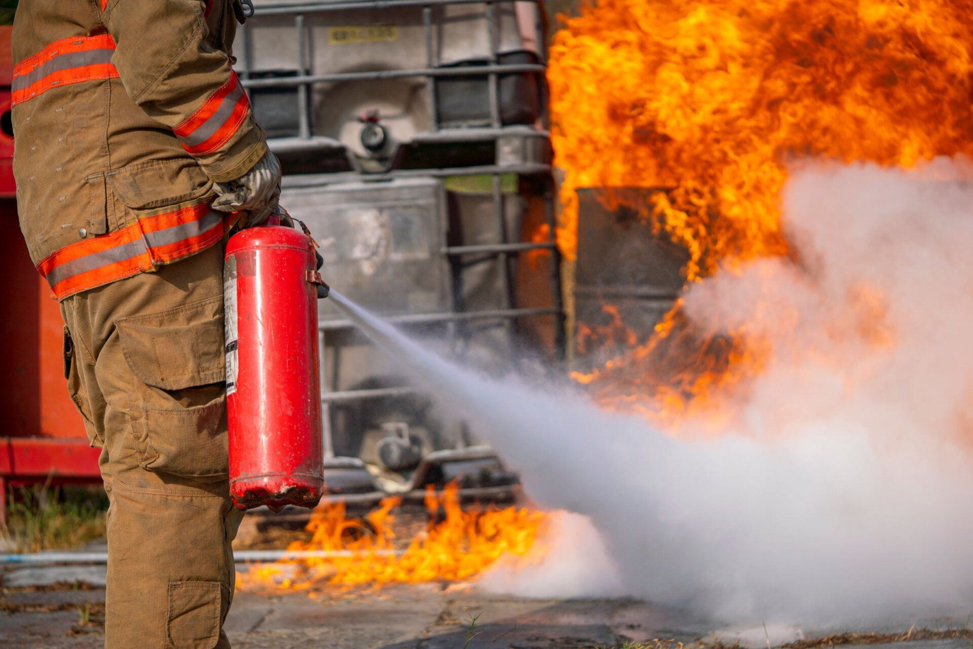 Man Using Fire Extinguisher — Dallas, GA — Commercial Fire Extinguishers, Inc