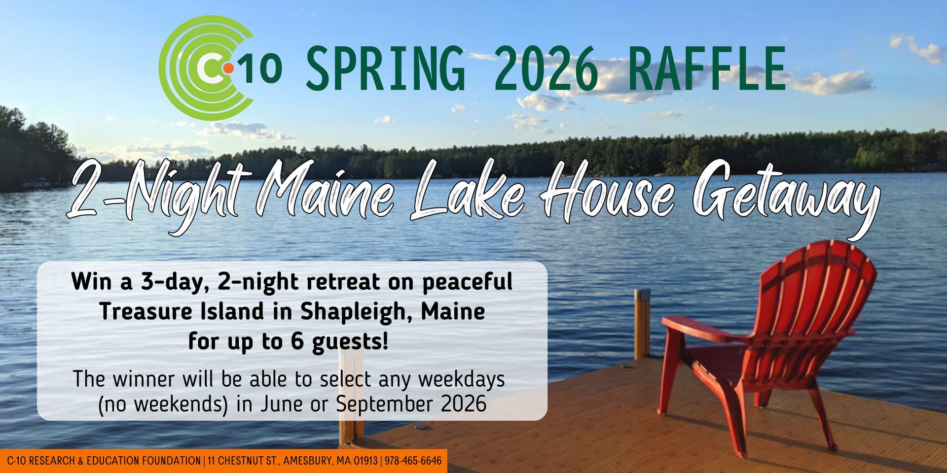 This image shows an orange Adirondack chair on a deck next to a large lake. There is a large forest surrounding the lack. 