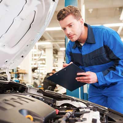 Mechanic Inspecting Vehicle — Auto Maintenance in King George, VA