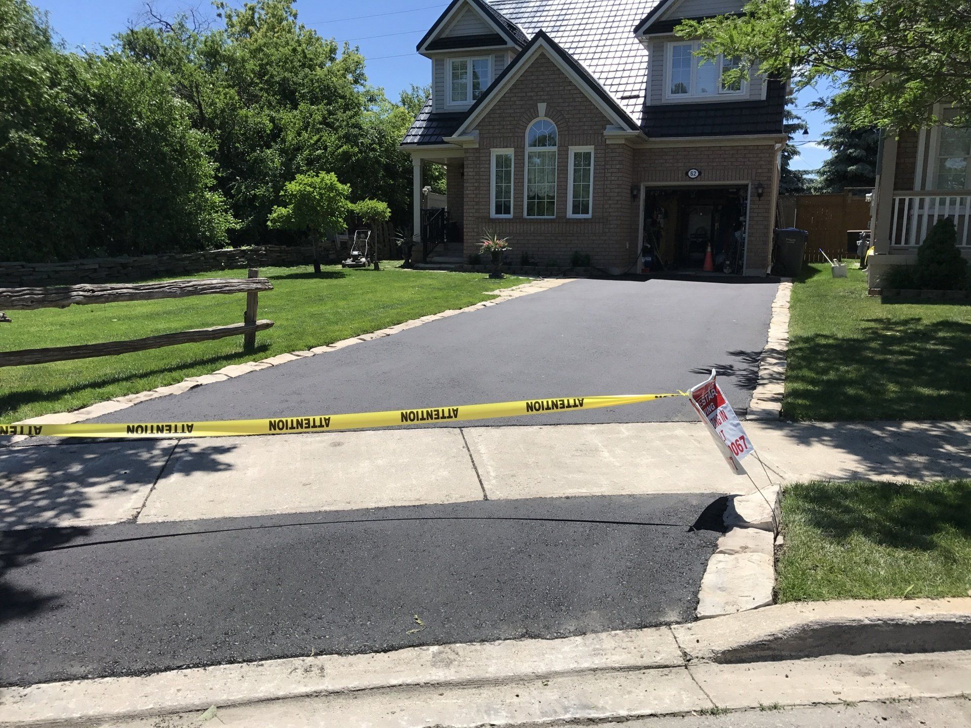 A house with a driveway that is being paved