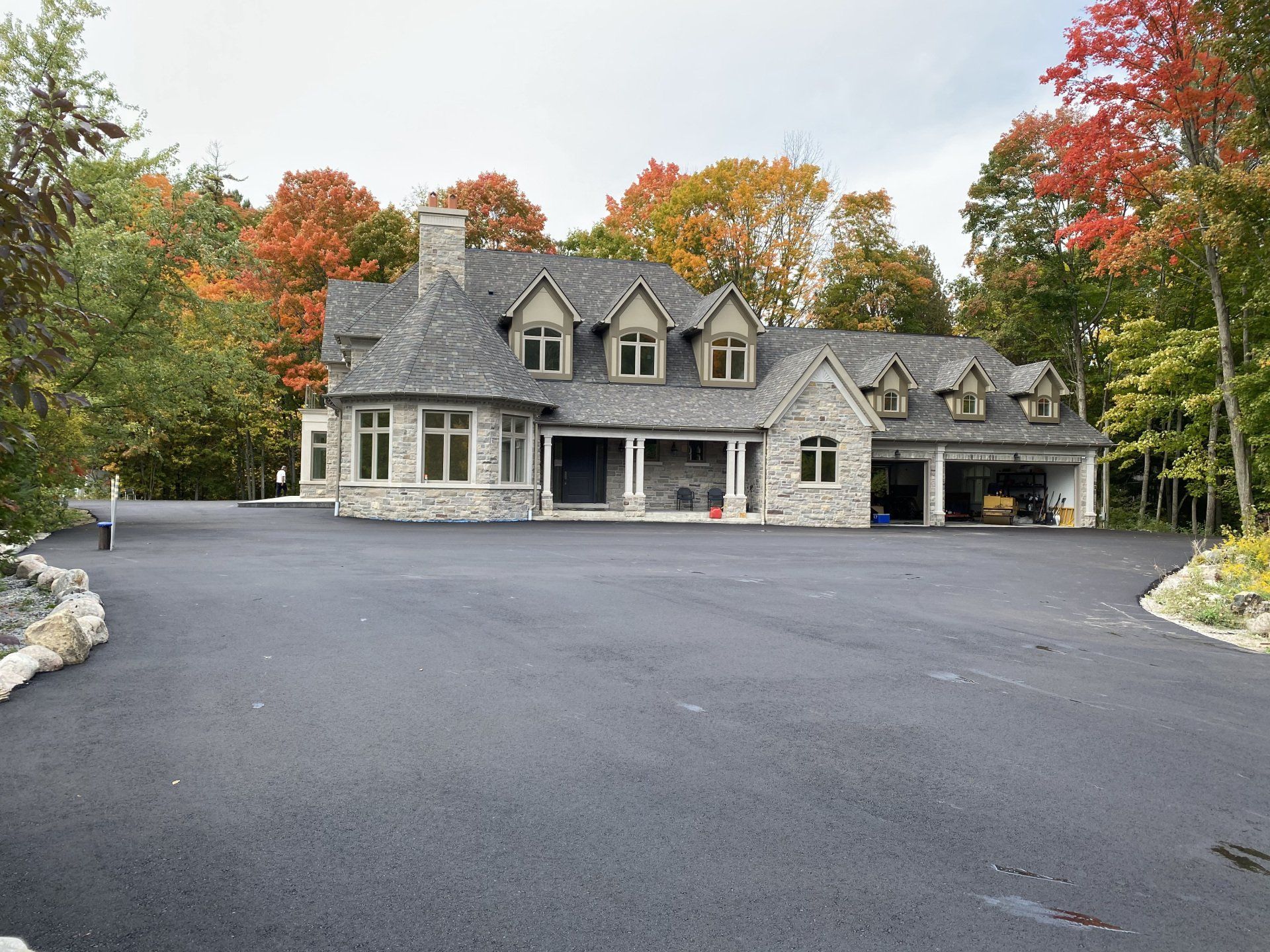A large house with a large driveway in front of it