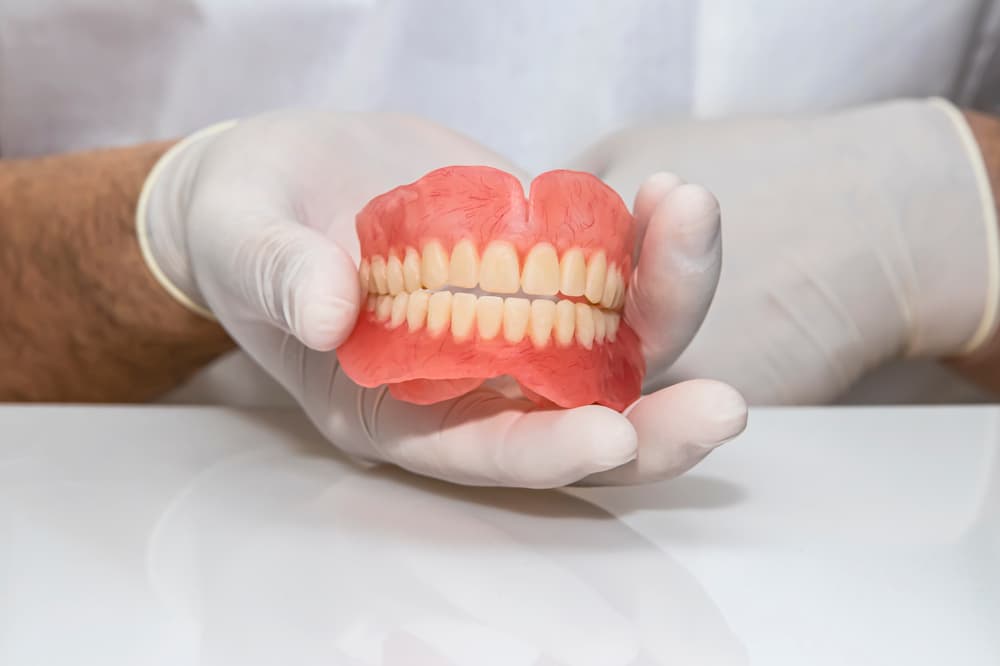 False Teeth On The Hand - Custom Mouthguards In Albury, NSW