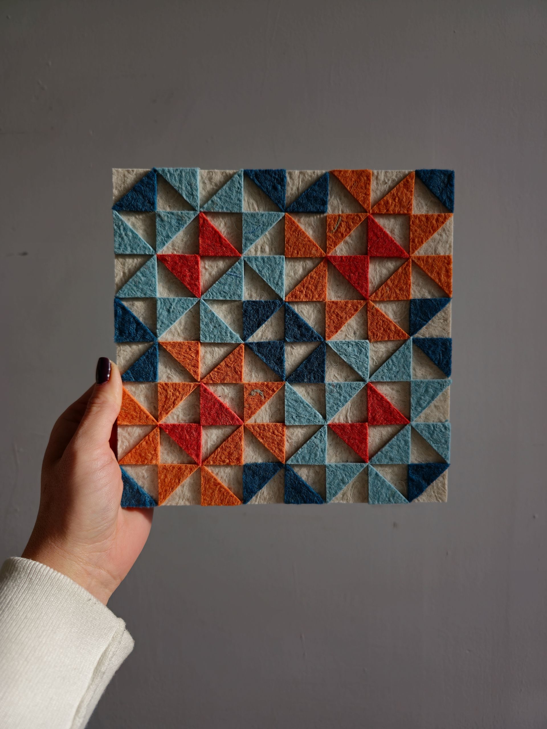 Textured wall art panel made from recycled textile waste