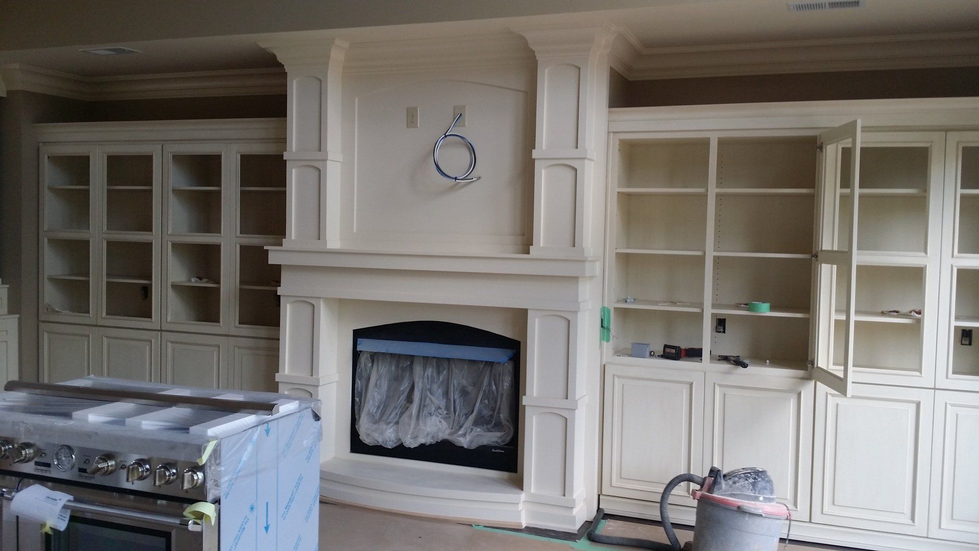 White wall with built-in bookcases