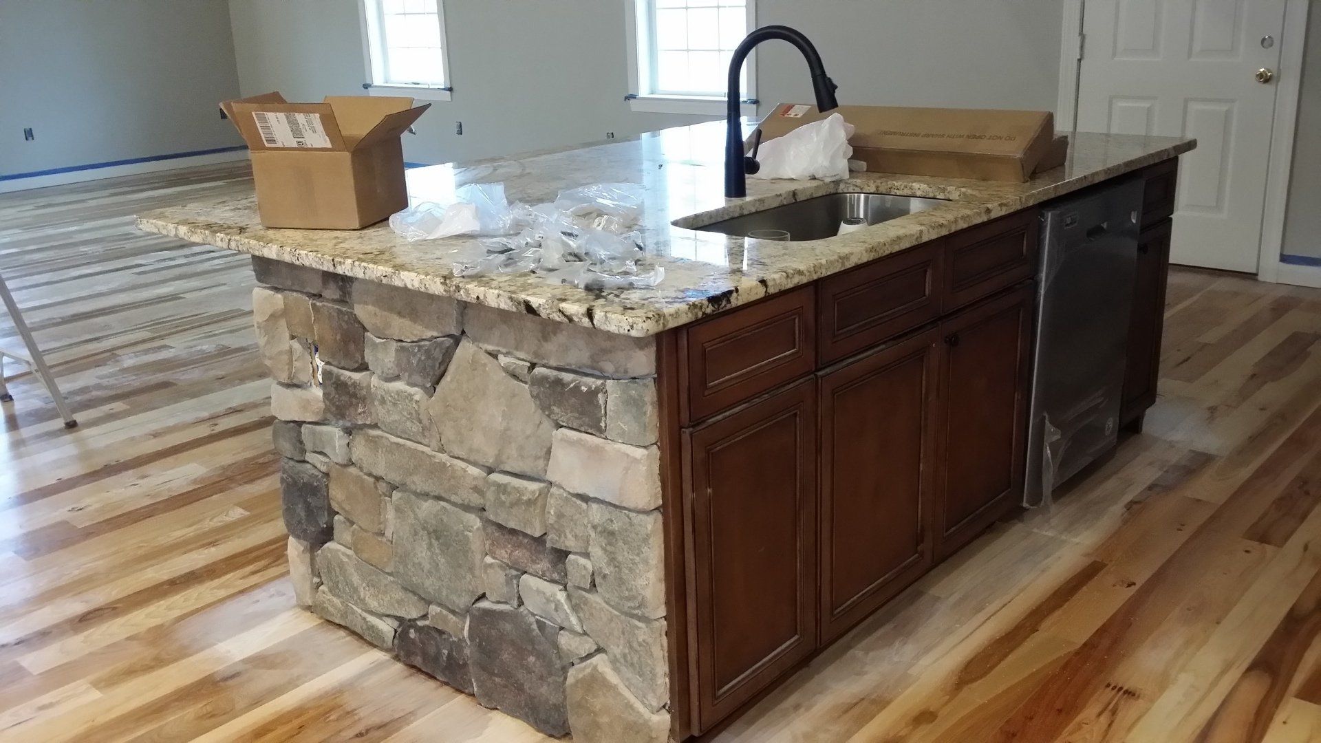 Unique center kitchen island with stonework