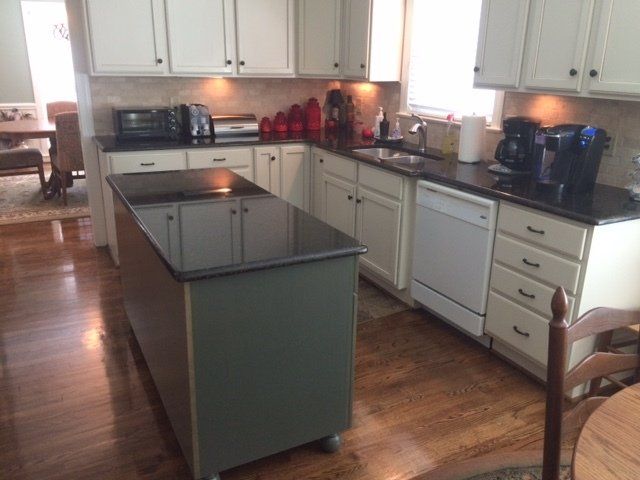 Recent kitchen with a blue island