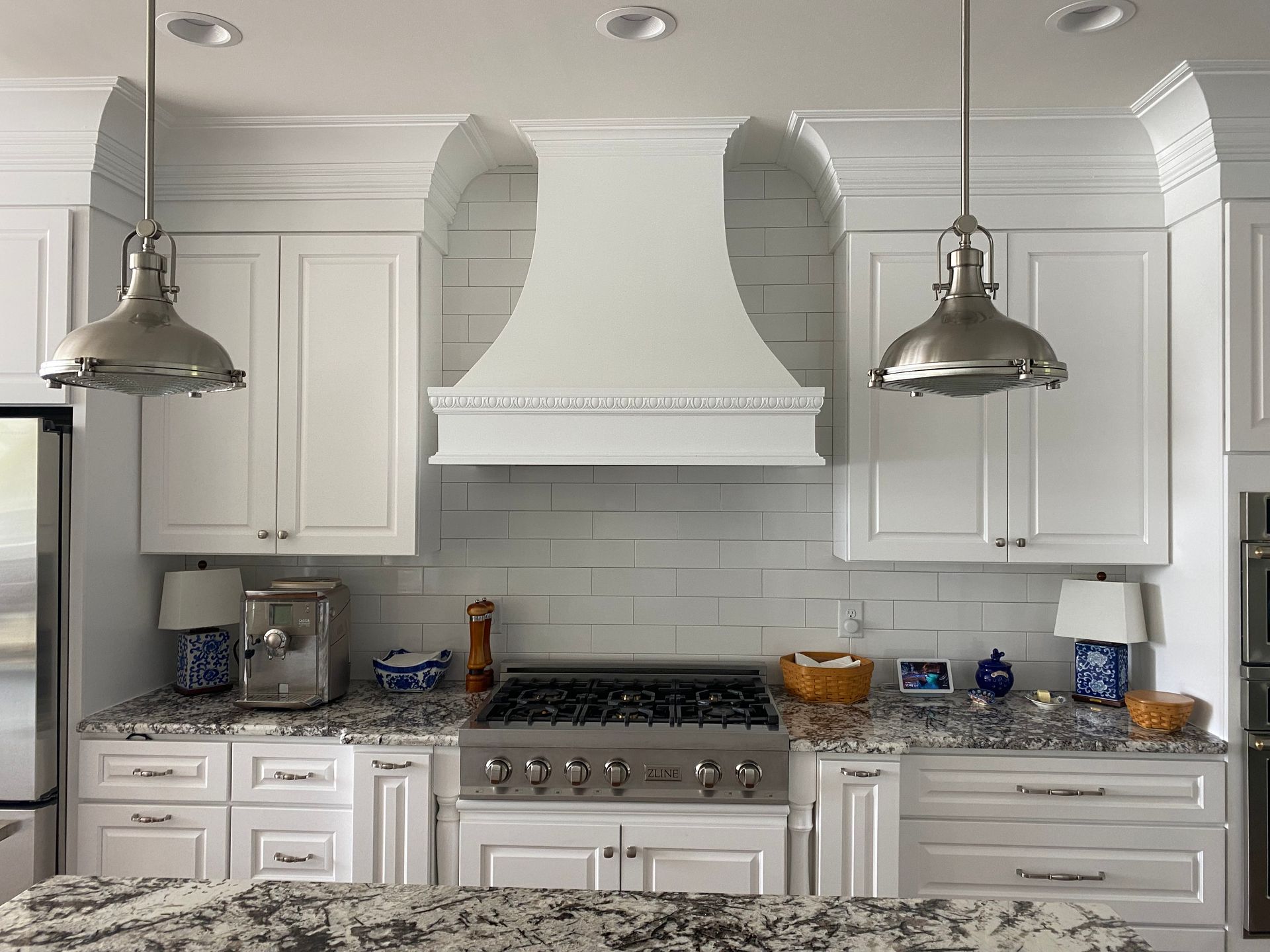 white kitchen with silver lighting