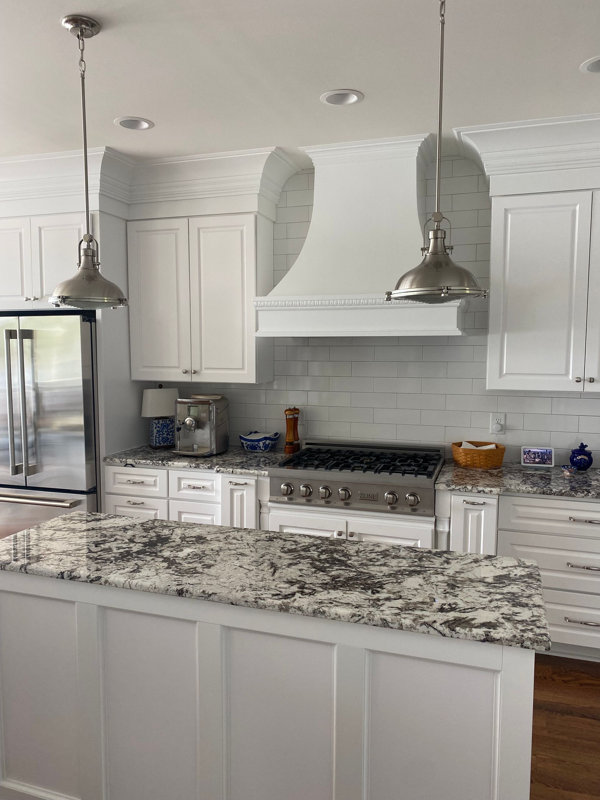 white kitchen with marble counters