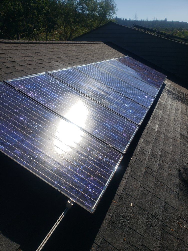 A Row Of Solar Panels Sitting On Top Of A Roof – Rohnert Park, CA - Josh’s Window Cleaning