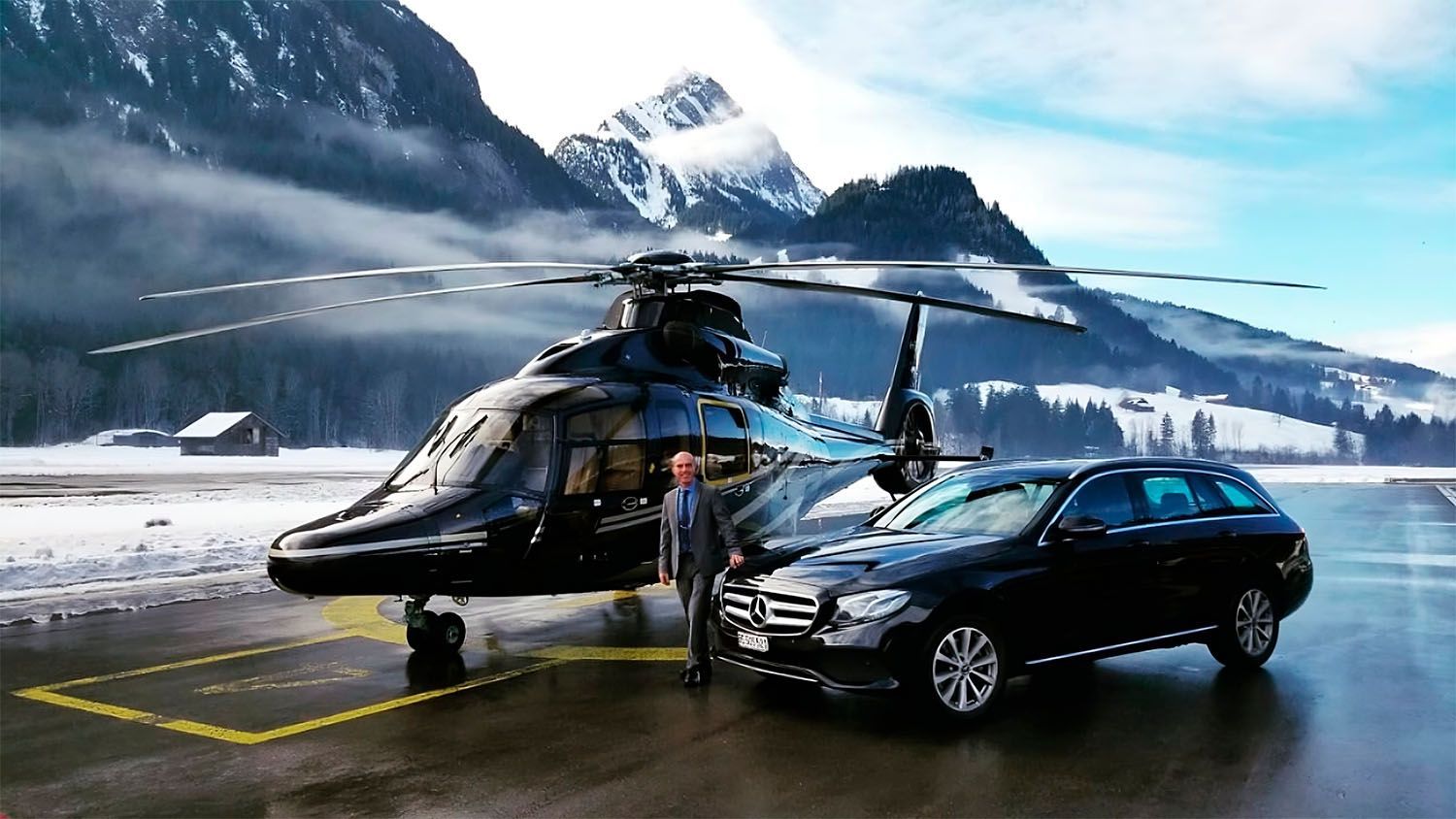 Black helicopter and Mercedes car with a CEO in a suit, snowy mountain backdrop.