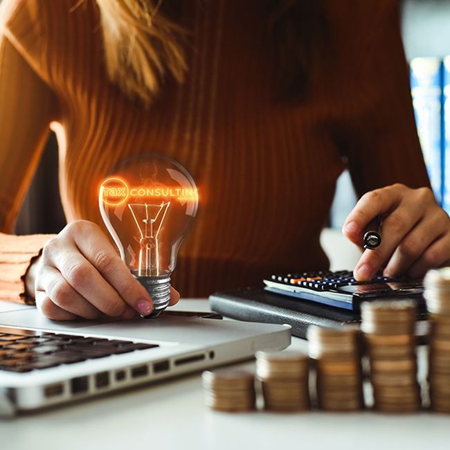 Woman holding lightbulb with 