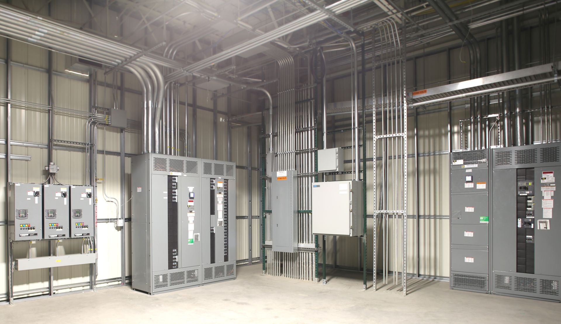 An electrician on a roof expertly installing a security camera to enhance home security.