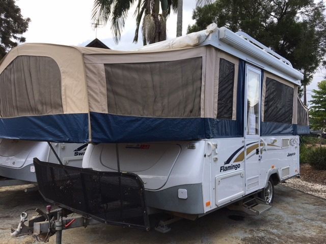 Two Camper Trailers Are Parked Next To Each Other — Perkins Caravans in Ballina, NSW