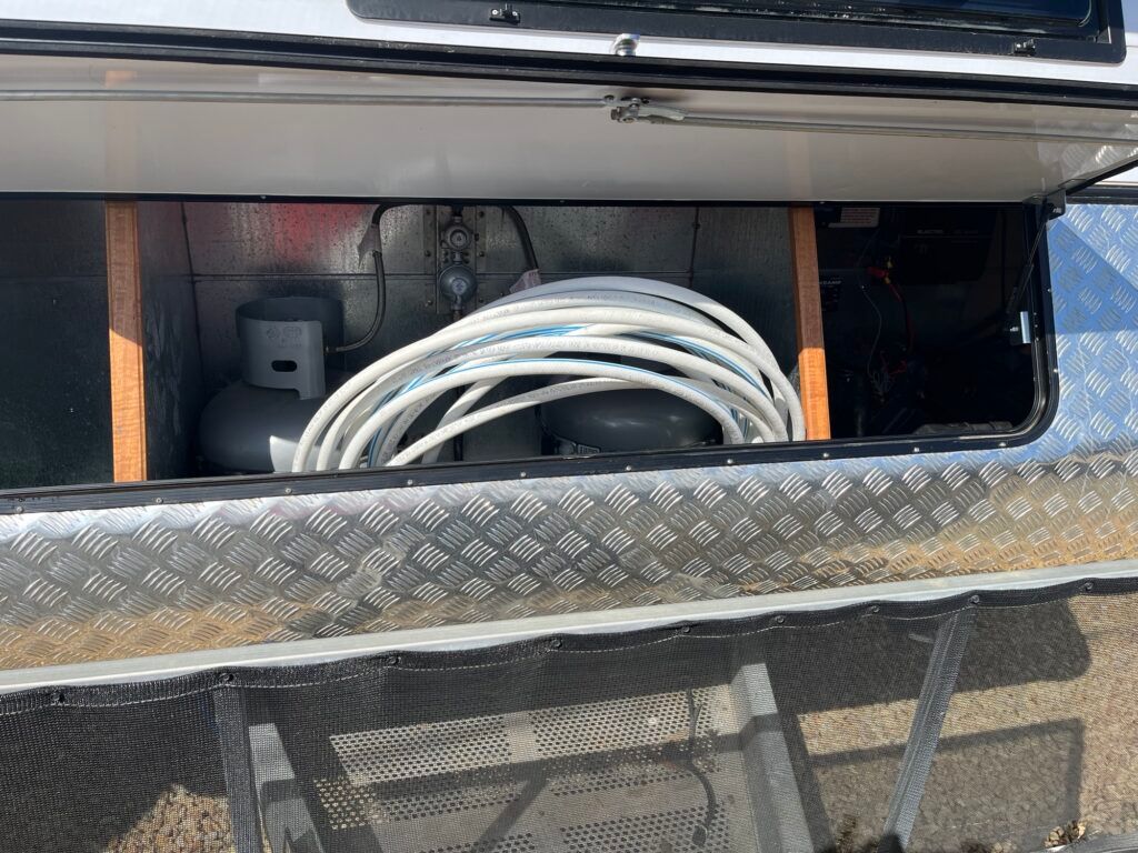 A Bunch Of Wires Are Sitting In The Back Of A Trailer — Perkins Caravans in Ballina, NSW