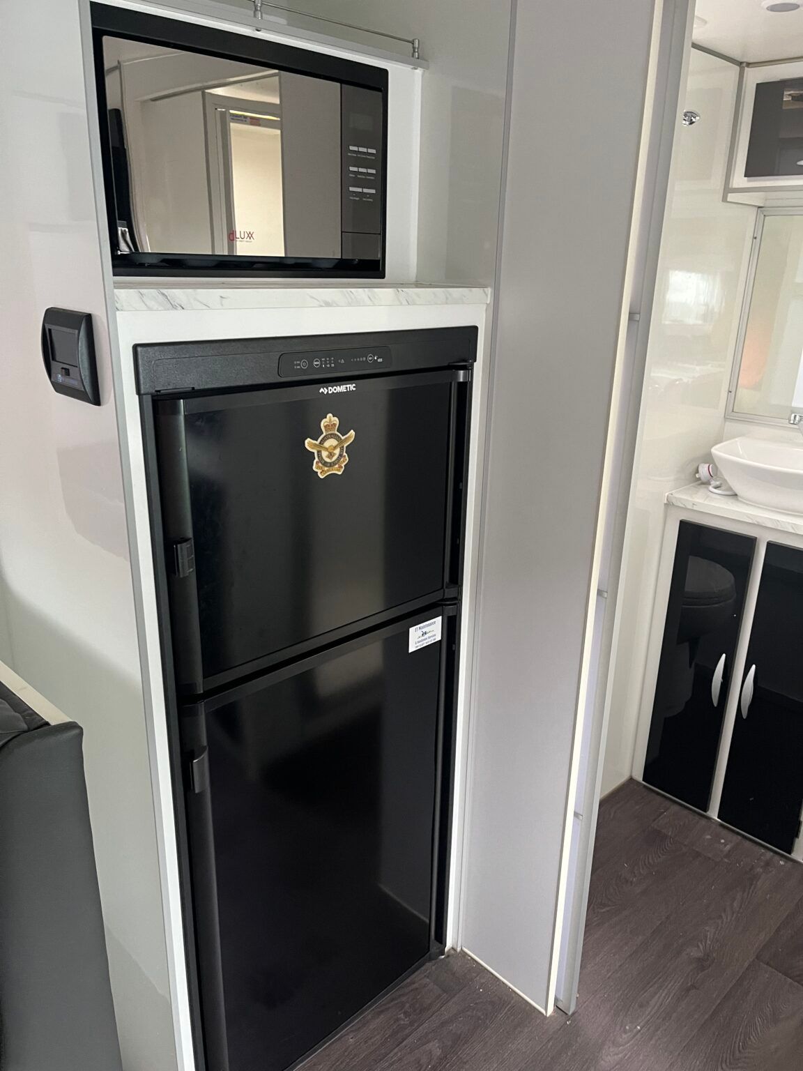 There Is A Black Refrigerator In The Corner Of The Room — Perkins Caravans in Ballina, NSW
