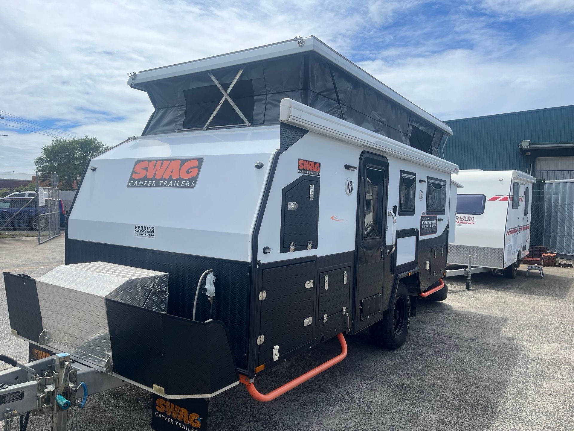A Used Hybrid Pop Top on display in a sales yard - Perkins Caravans Ballina