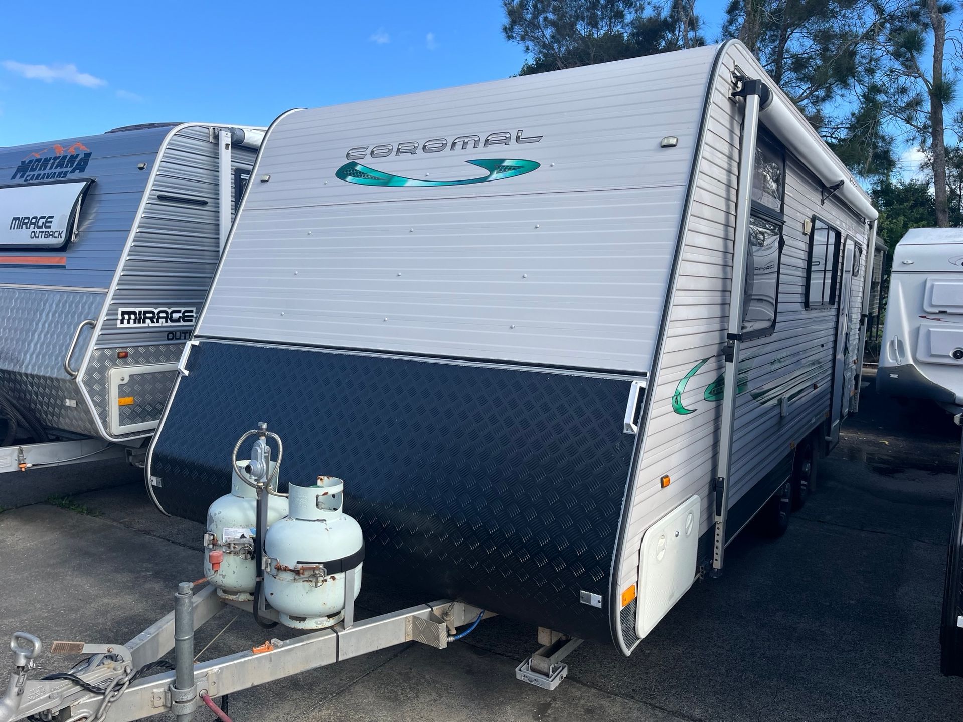 A used caravan on display in a sales yard - Perkins Caravans Ballina