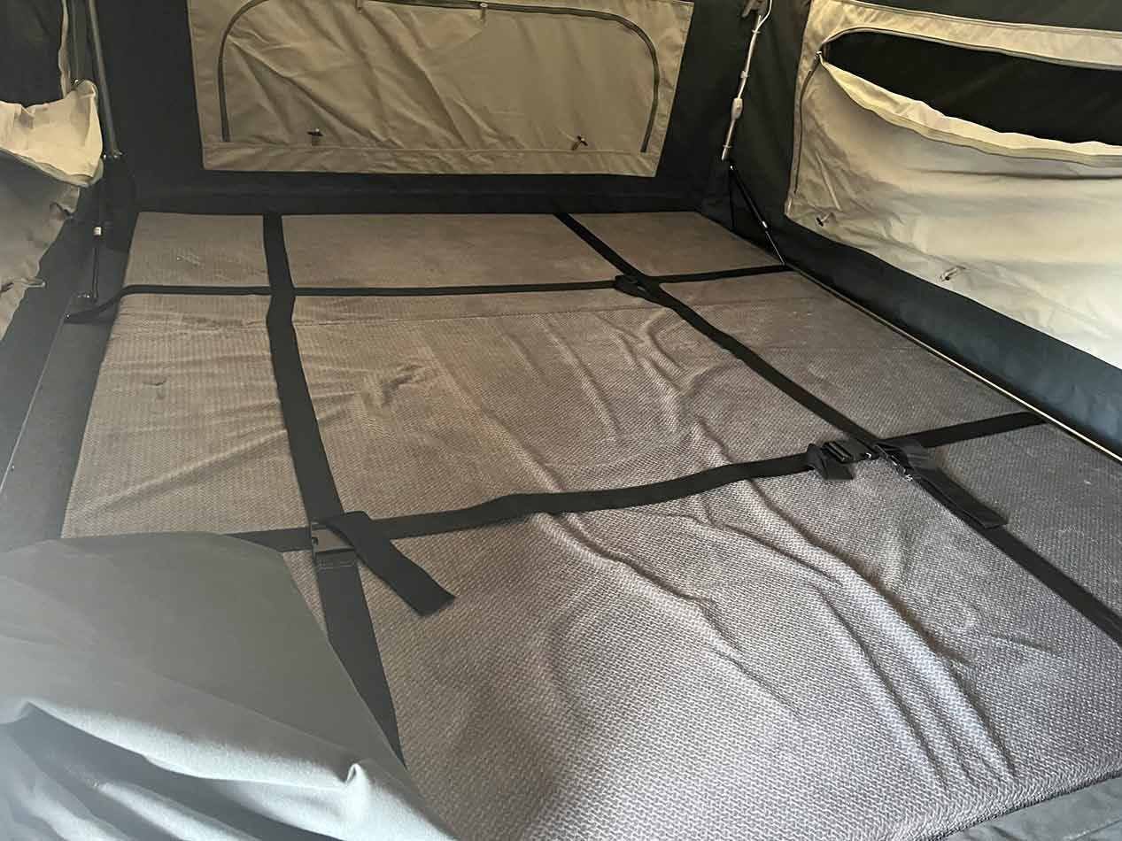 The Inside Of A Tent With A Blanket On The Floor — Perkins Caravans in Ballina, NSW