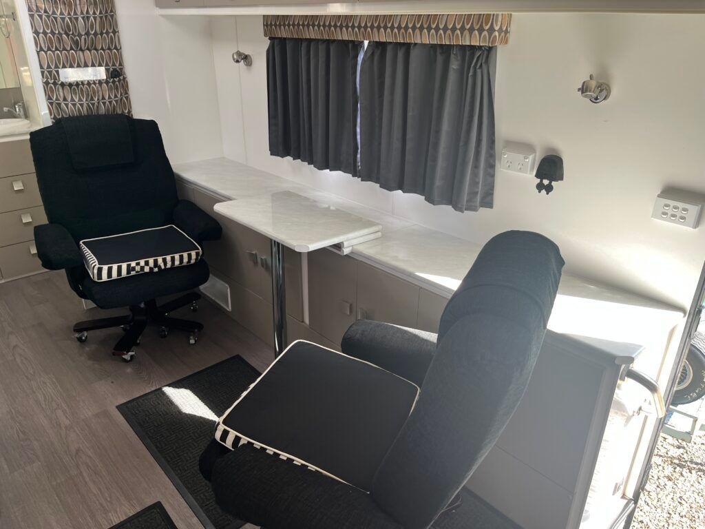 There Is A Chair And A Table In The Room — Perkins Caravans in Ballina, NSW