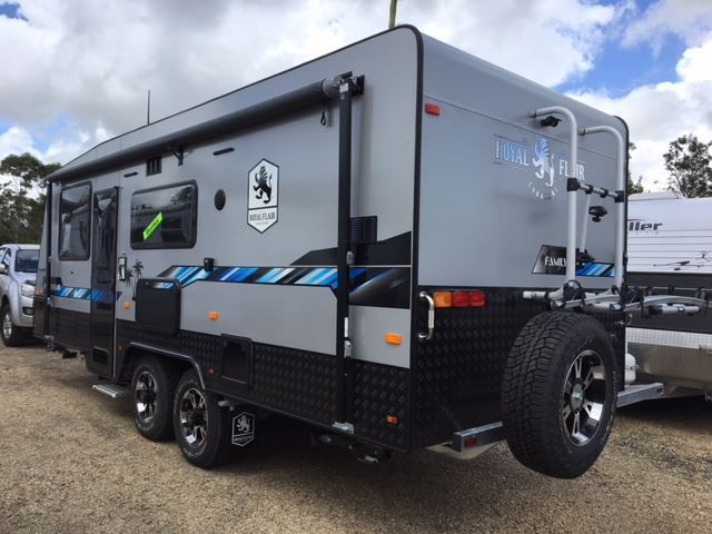 A Gray And Black Trailer Is Parked In A Parking Lot — Perkins Caravans in Ballina, NSW