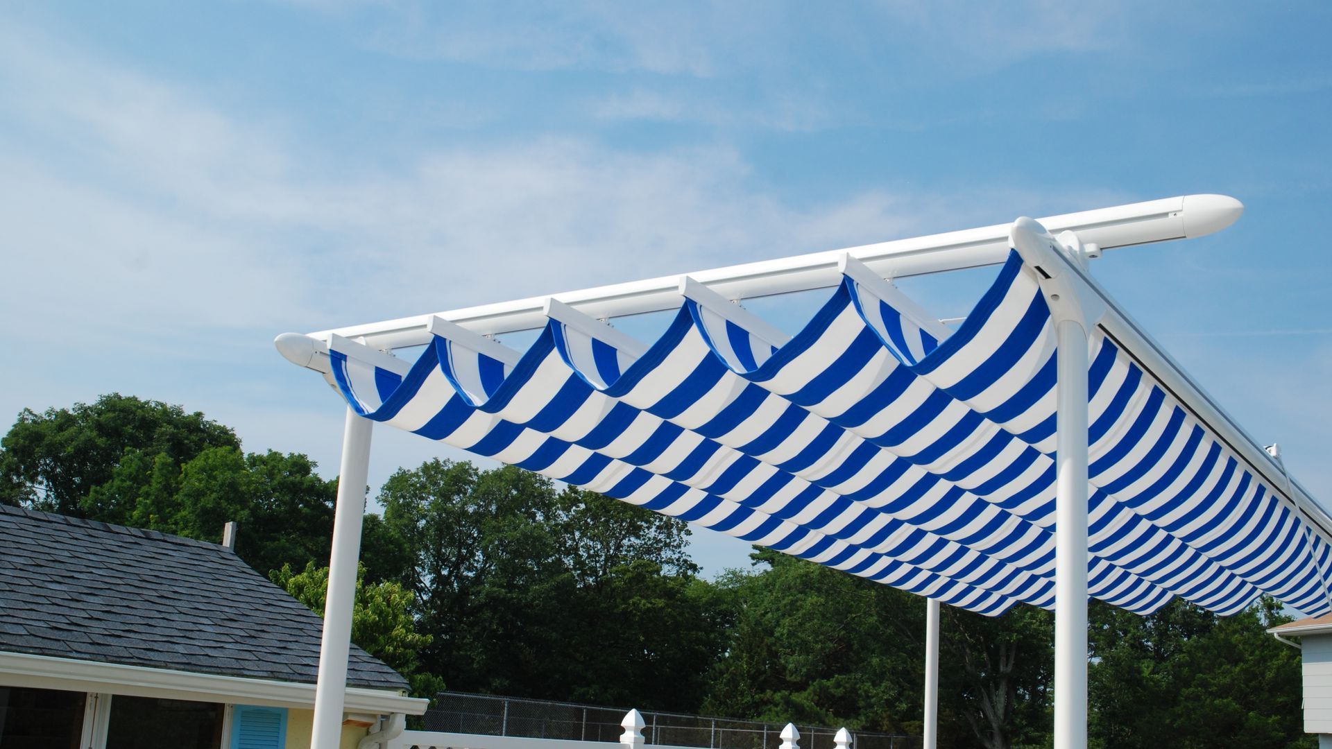 A blue and white striped canopy with a white frame