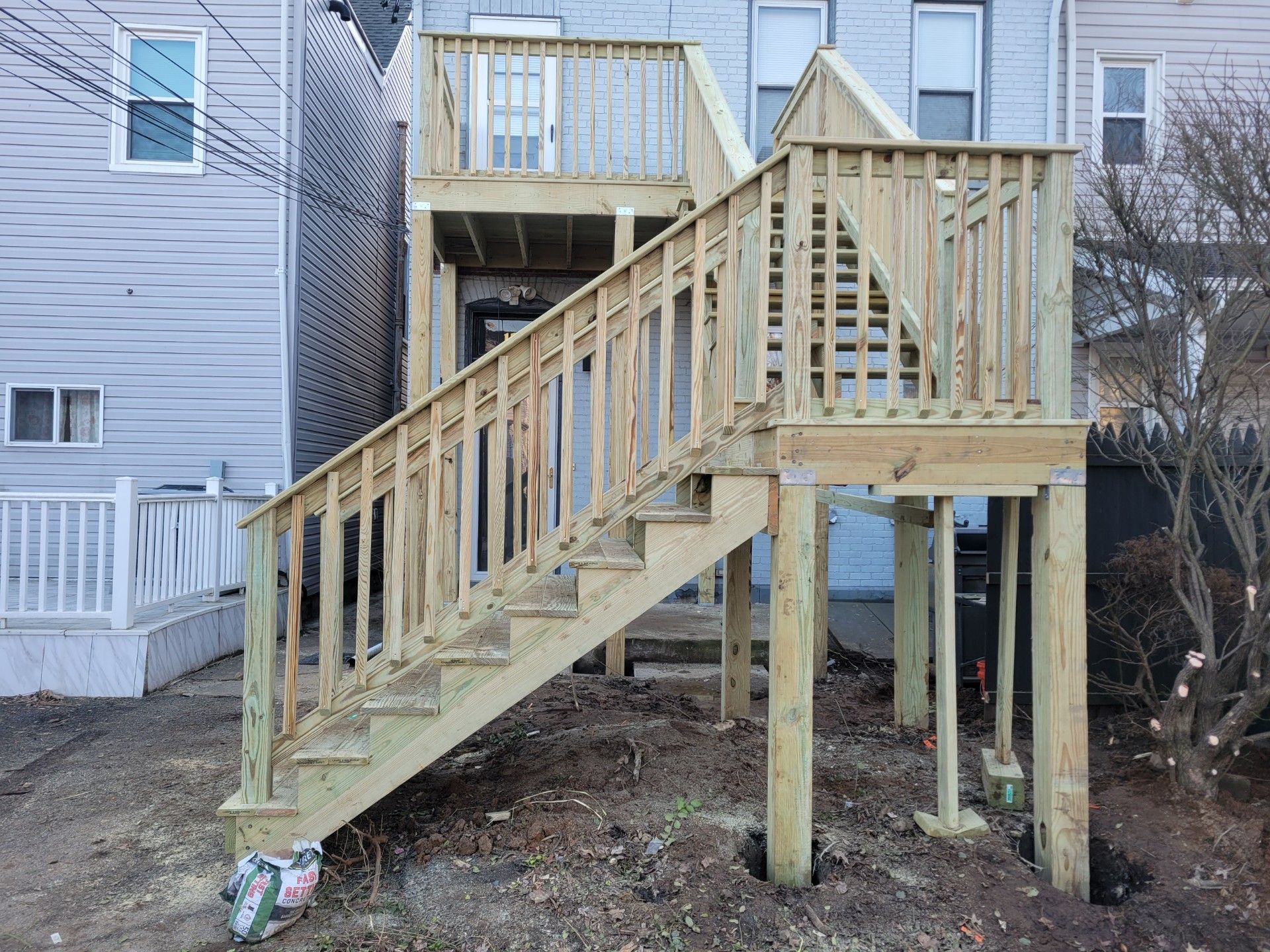 A wooden deck with stairs leading up to it