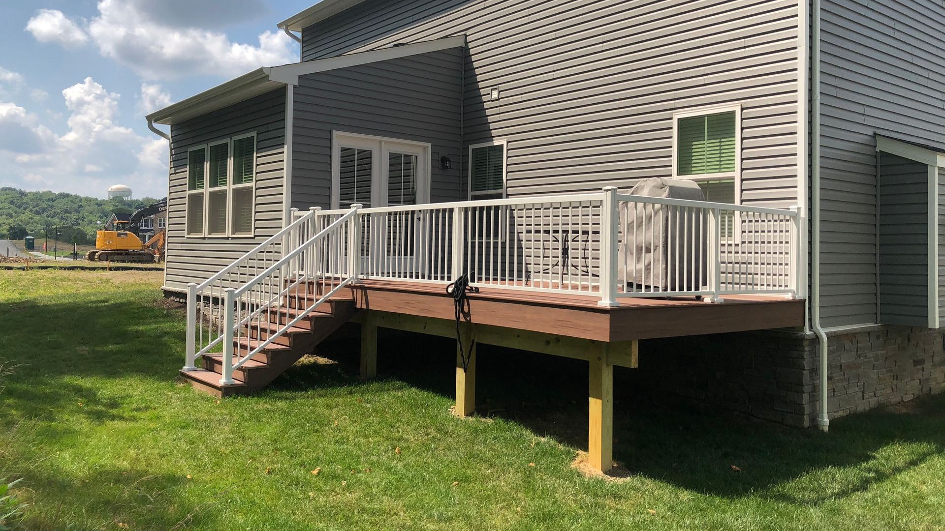 The back of a house with a deck and stairs