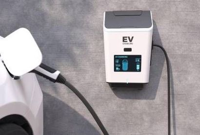 A man is using a multimeter to test an electrical box.