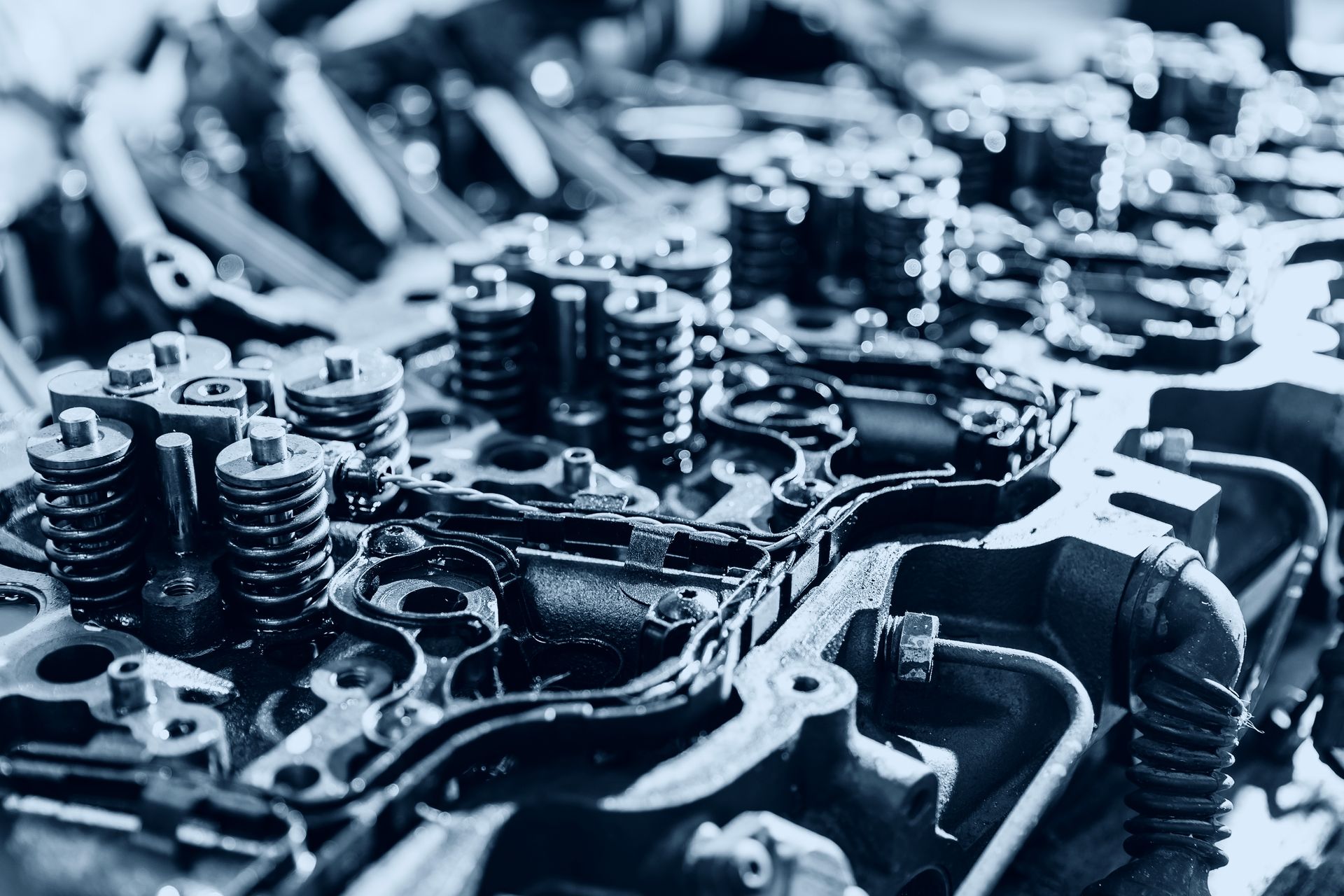 A close up of a car engine with a lot of metal parts.